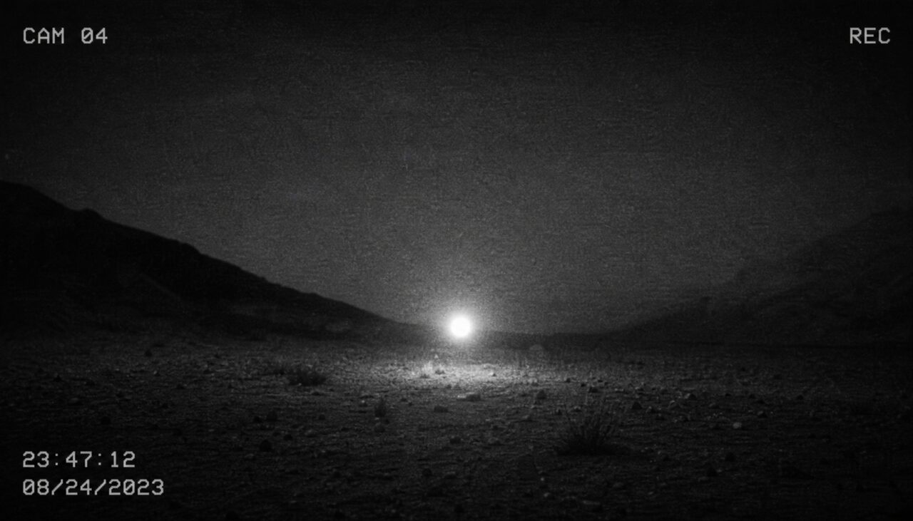 A single grainy frame: a bright ball just above dark ground, timestamp in the corner. The luckiest second in atmospheric physics.