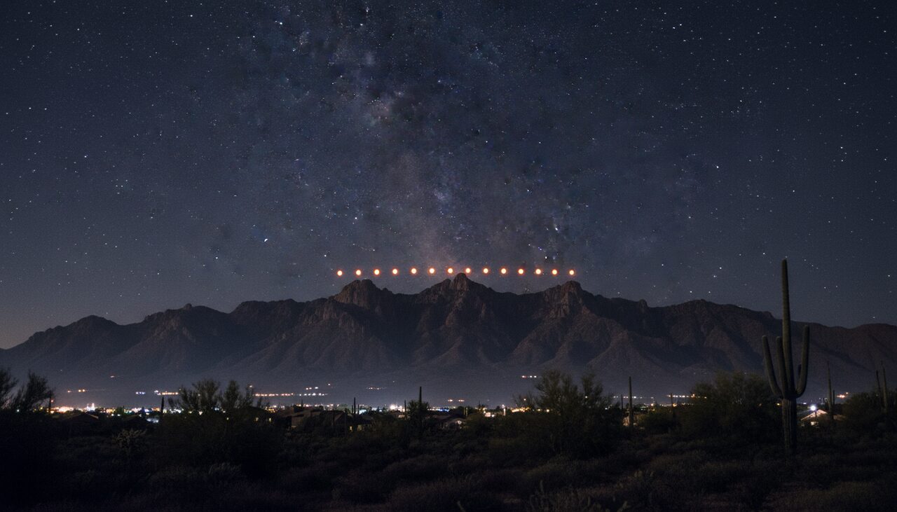 A row of stationary amber lights above the Estrella ridge. This is the half that got filmed.
