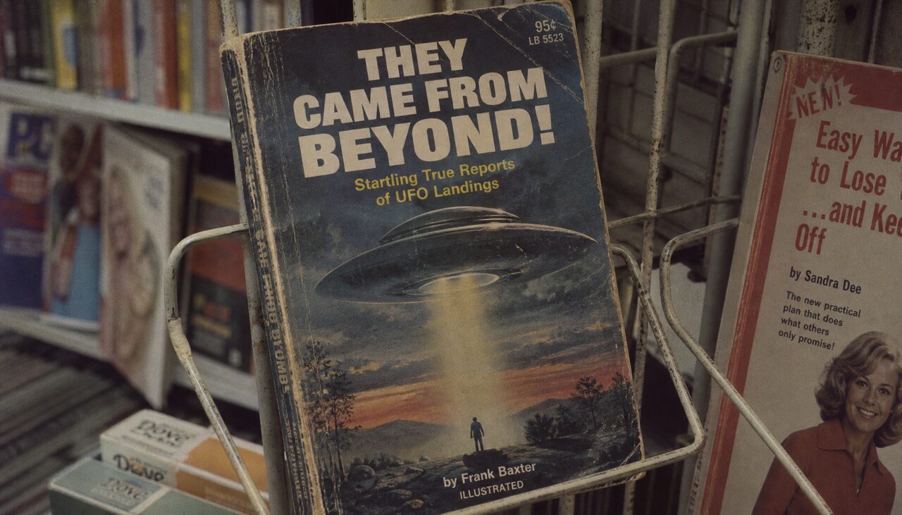 A drugstore paperback rack, where the 1947 debris got its sequel.